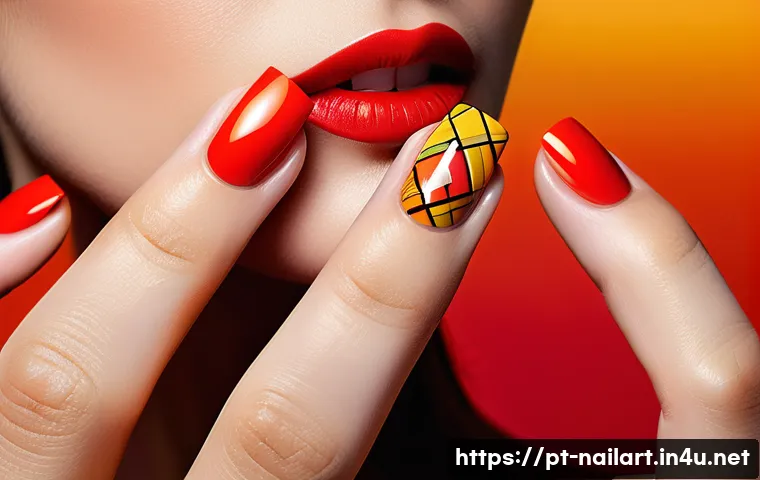 네일아트 디자인의 심리적 효과 - A close-up of a female hand with well-manicured nails painted in vibrant red, orange, and yellow hue...